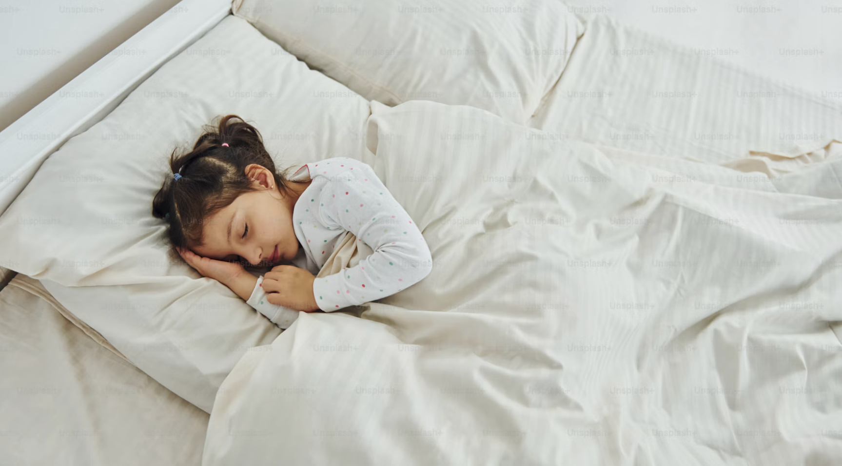 Image of a child in bed sleeping